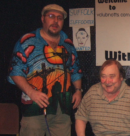 Bernard Manning seated with Pav compere at the Variety club Notts standing along side