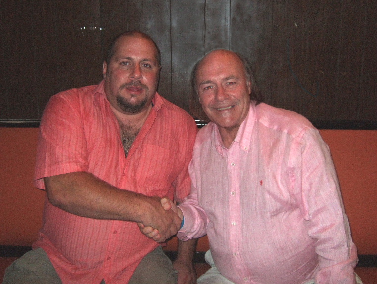 Comedian Mick Miller shaking hands with Pav the compere of the Variety Club Radford.